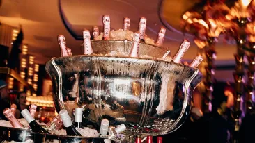 Champagne bottles in iced buckets at an event