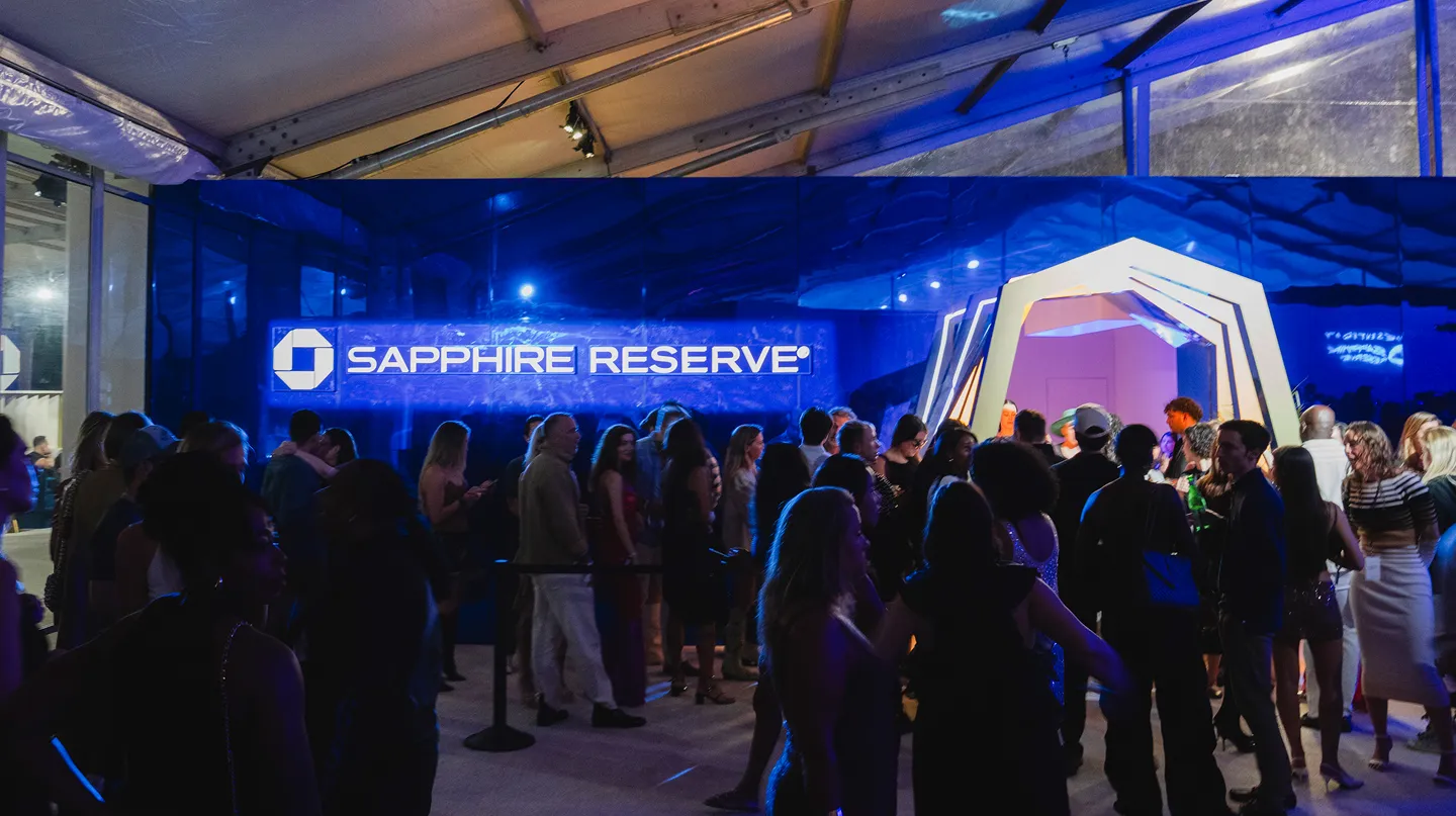 A crowd standing to get into a Sapphire Reserve event