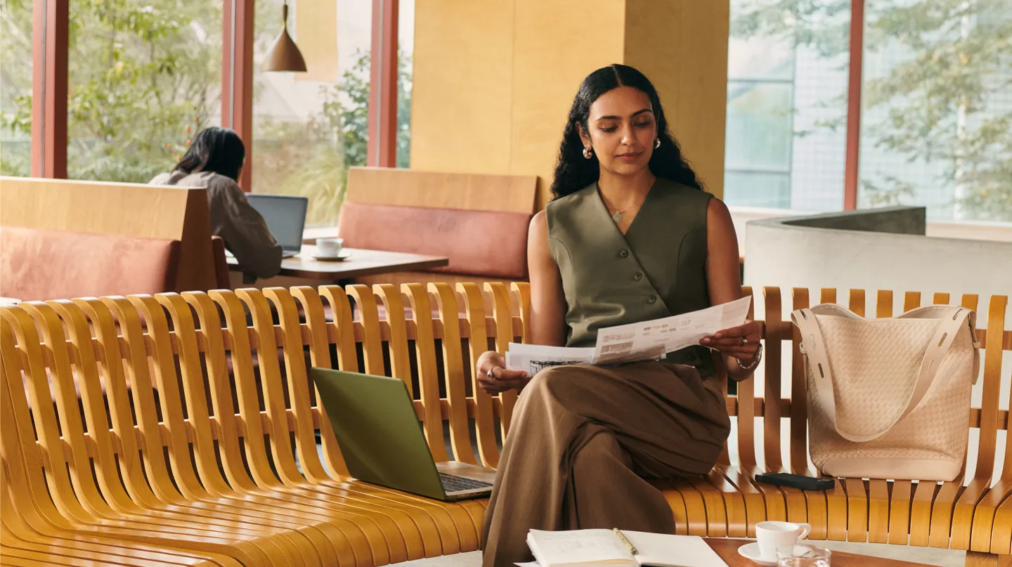 Woman sitting on a bench at the Sapphire Lounge.