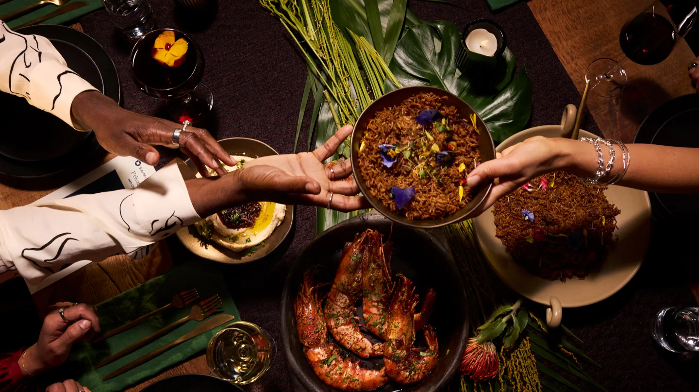 People Sharing food at a dining table