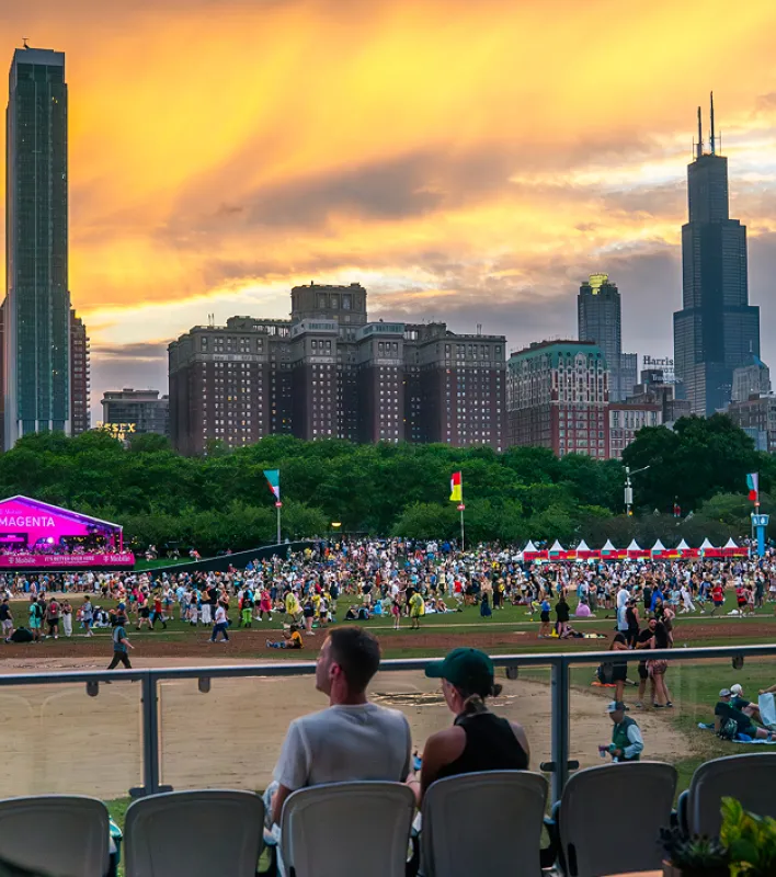 A sports game at a park in a metropolitan city